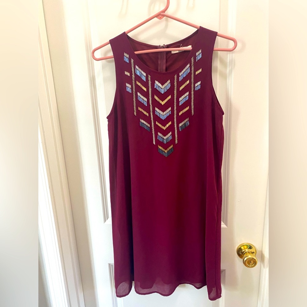 Burgundy (not purple) shift dress with beautiful detail.